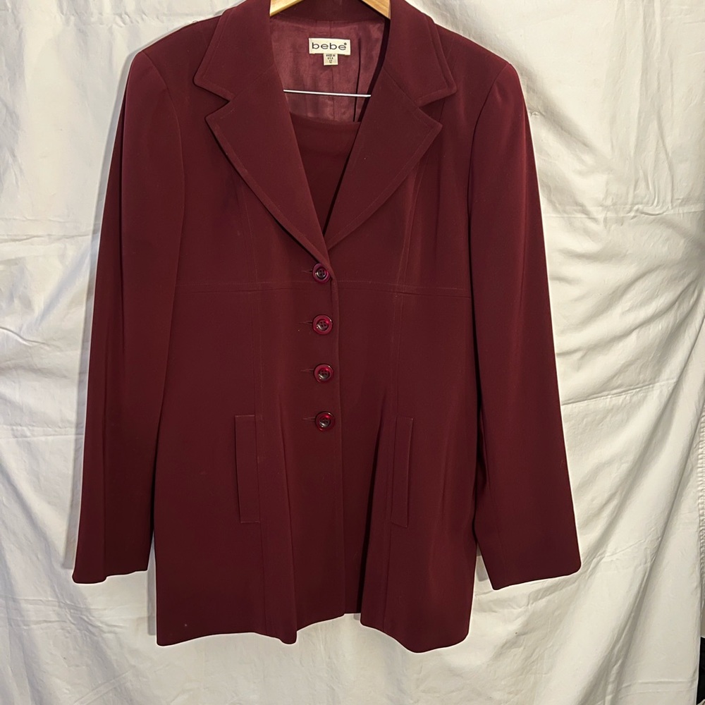 Bebe long jacket and skirt cherry black color size 12.